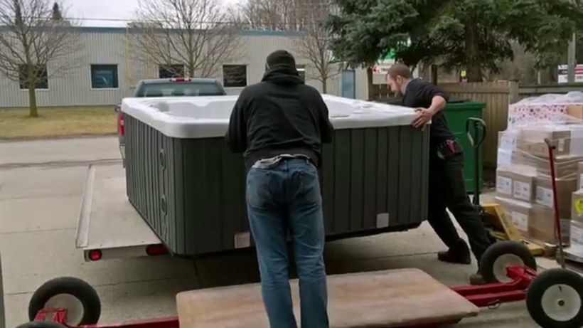 Ava's Moving Service crew handling a piece on a Rhode Island job